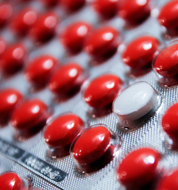 Medication error prevention strategies shown with pill and alert graphics.