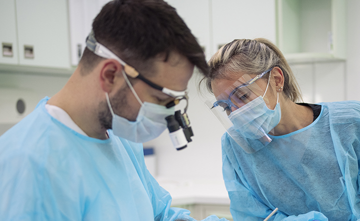 Dental claims visual with dentist tools and charts.