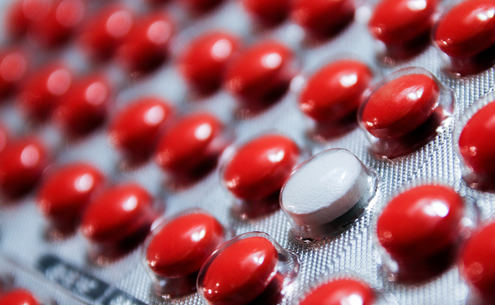Medication error prevention strategies shown with pill and alert graphics.