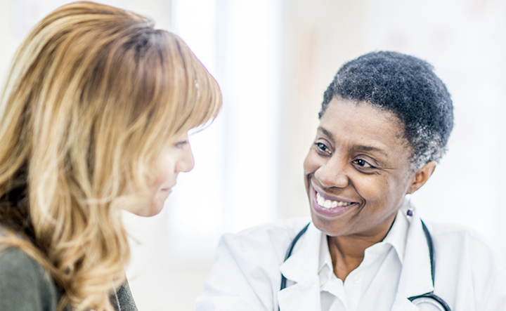 Visual of a healthcare professional interacting with patient engagement tools